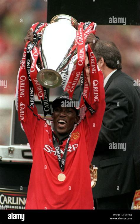 Manchester Uniteds Dwight Yorke Lifts The Fa Carling Premiership Trophy