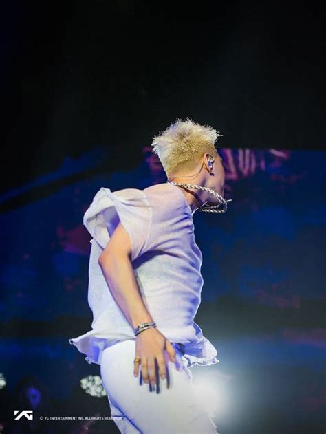 A Woman With Blonde Hair Is Performing On Stage