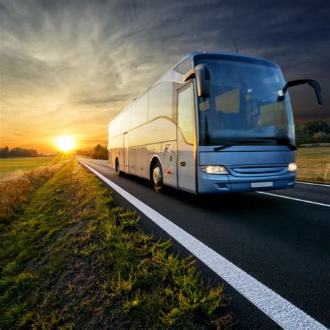 Bus Traveling On The Asphalt Road In Rural Landscape At Sunset1