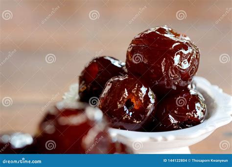 Sweet Jujube Or Chinese Red Date In Syrup In White Thai Style Cup On