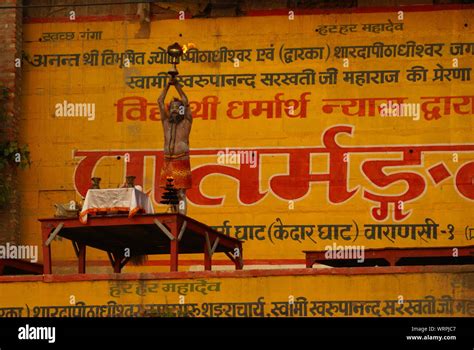 Hindu ritual of a holy man in Ganges river (Varanasi Stock Photo - Alamy