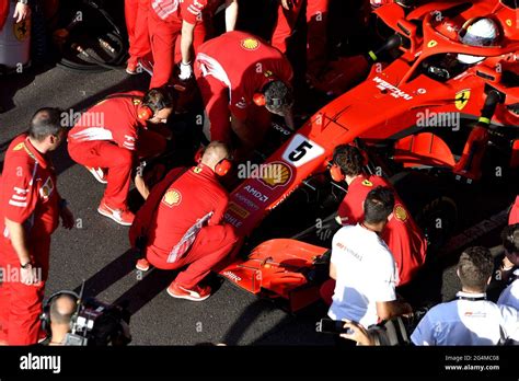 Ferraris Pit Stop Crew Working Around The Ferrari Formula One At The