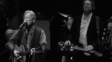 Watch Eric Clapton Perform While My Guitar Gently Weeps With Jerry Douglas And Dedicate Sam