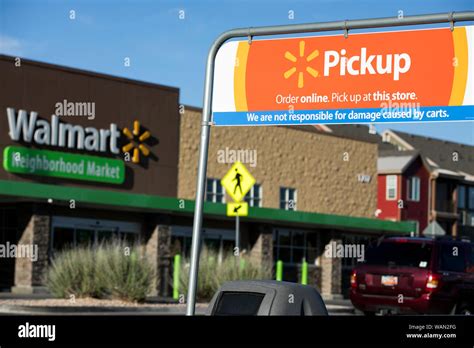 A Logo Sign Outside Of A Walmart Neighborhood Market Retail Store