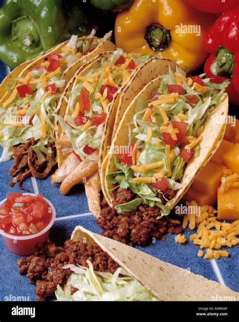 Assortment Three Hard Shell Tacos Beef Chicken Steak Cheese Lettuce Tomato Tomatoe One Soft Taco