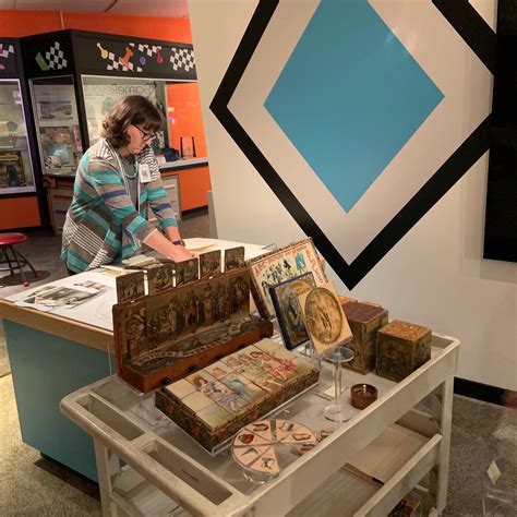 Museum curators install a new display... - The Strong Museum