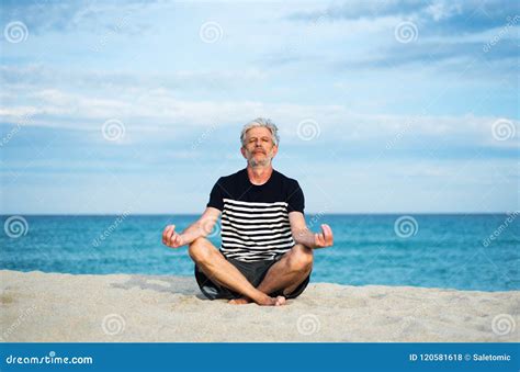 Senior Man Meditating On The Beach Stock Photo Image Of People