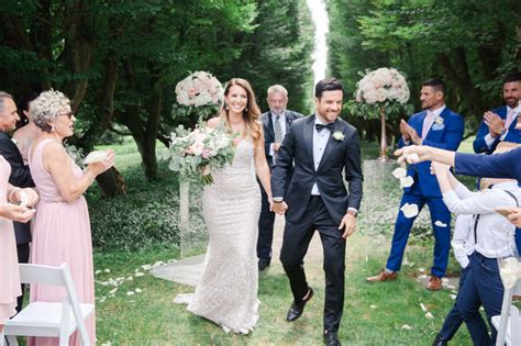 Bride And Groom Walking Back Down Aisle As Mr And Mrs Tent Wedding