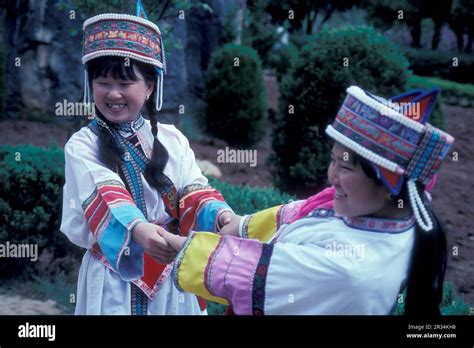 People In Traditional Costume Of Chinese Minorities Posing At The