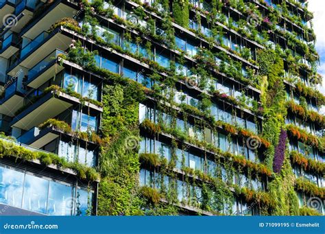 Green Skyscraper Building With Plants On The Facade Stock Image Image