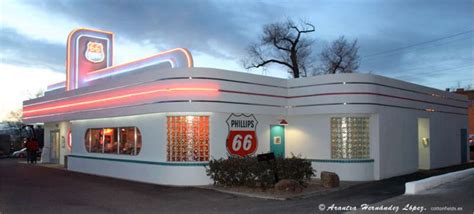 The Exterior Of A Diner With Neon Lights