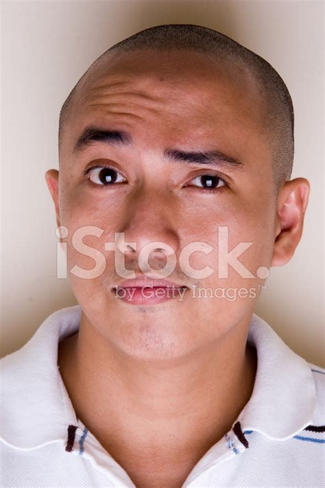 Asian Male With Raised Eyebrow Stock Photo Royalty Free Freeimages