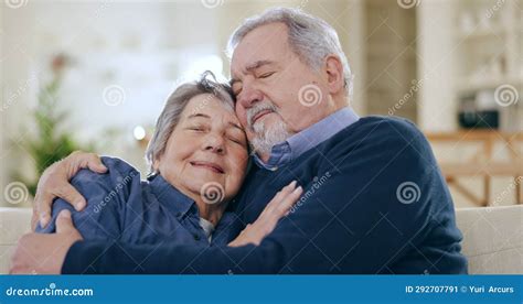 Happy Senior Couple And Hug In Home For Love Care And Together For