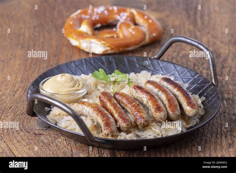 Grilled Nuremberger Bratwurst With Sauerkraut Stock Photo Alamy