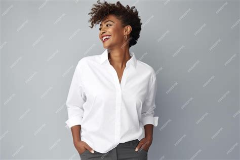 Premium Photo A Woman Wearing A White Shirt And Grey Pants