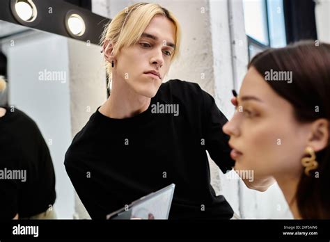 Brunette Woman Enjoying Makeup Session With Stylist Stock Photo Alamy