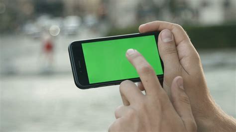 Close Up Man Holding Smartphone Touch Screen With Green Screen Chroma