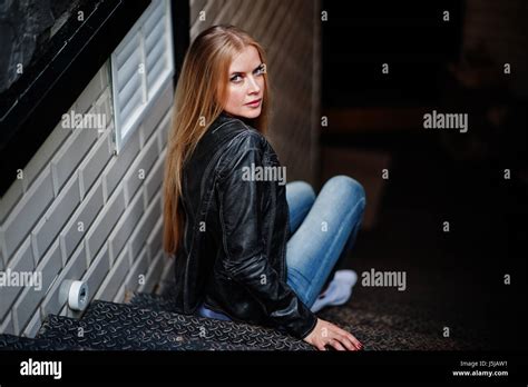 Stylish Blonde Woman Wear At Jeans Choker And Leather Jacket At Street