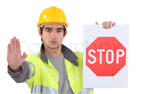 Road Worker Holding A Stop Sign Stock Image Colourbox