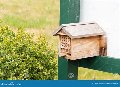 Bee Nest Box In A Garden Providing Habitat For Wild Bees Stock Photo