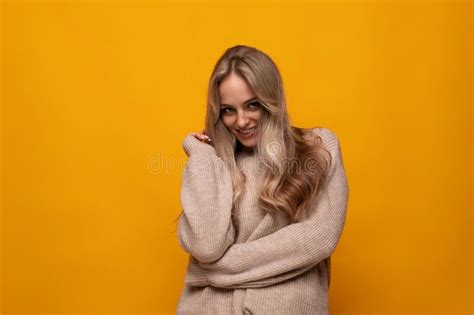 Photo Of Shy Blonde Girl On Yellow Background Stock Image Image Of