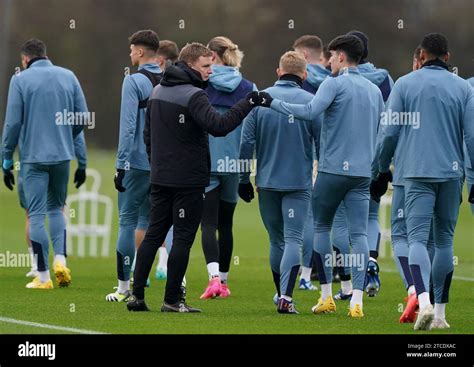 Newcastle United S Tino Livramento Fist Bumps Manager Eddie Howe During A Training Session At