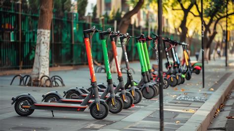 Premium Photo A Row Of Electric Scooters Parked On A City Street The