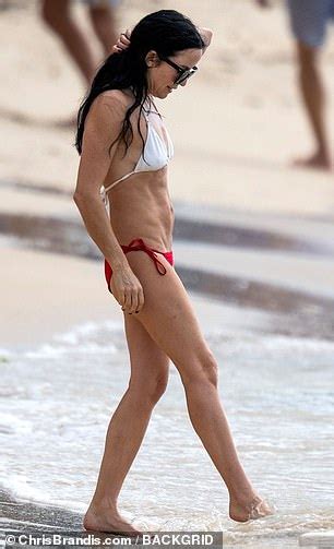 Andrea Corr Shows Off Her Lithe Physique In A Mismatched Bikini As She Hits The Beach For A