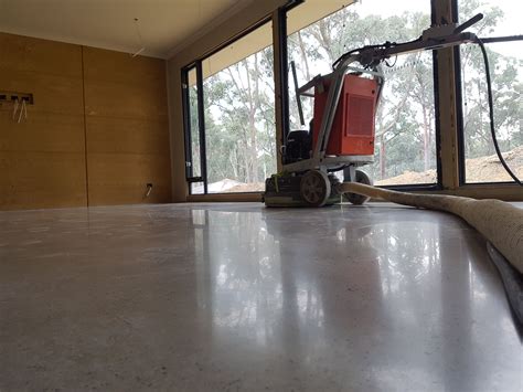 Galaxy Polished Concrete In Matte Finish With Random Stone Exposure By