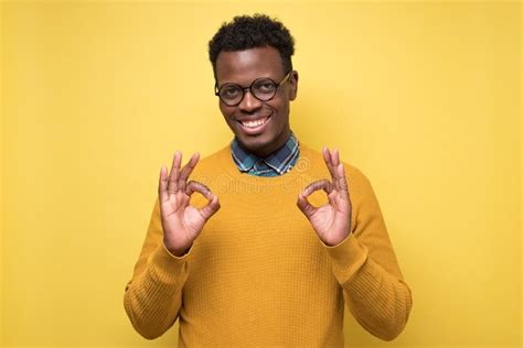 Portrait Of Happy African American Man In Glasses Showing Ok Sign And