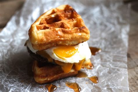 Waffle breakfast sandwiches made with sausage, eggs, melty cheddar ...