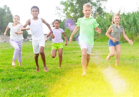 Barefoot Kids Running on Green Grass Stock Photo - Image of cameroonian ...