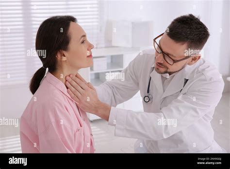 Doctor Examining Thyroid Gland Of Patient In Hospital Stock Photo Alamy