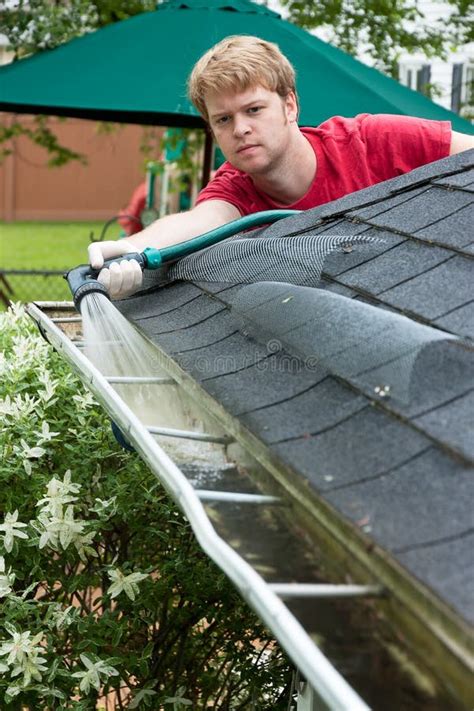 Cleaning Gutters stock photo. Image of maintaining, outside - 19933522