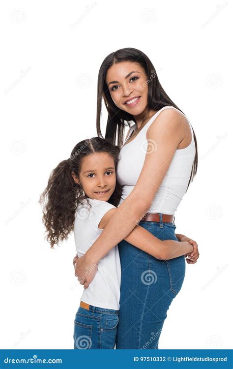 Beautiful Happy Mother And Daughter Standing Embracing And Smiling At