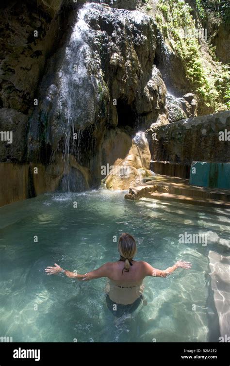 A Woman Bathes In The Natural Hot Water Mineral Baths Near The Pitons In Southern St Lucia Stock