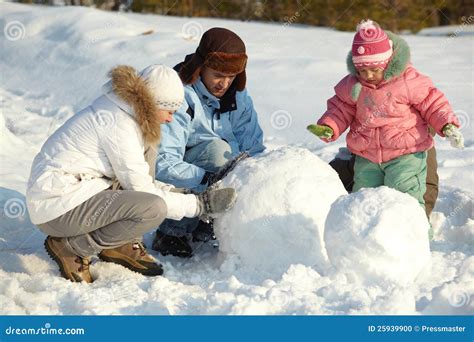 Making snowman stock photo. Image of father, cold, natural - 25939900