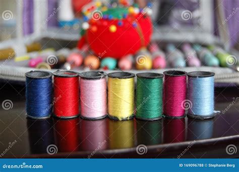 Colorful Sewing Threads In A Row Of Spools Stock Photo Image Of