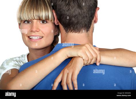 Blonde Woman Hugging Man Stock Photo Alamy