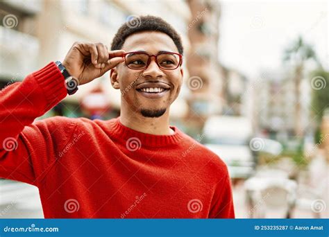 Handsome African American Man Outdoors Holding Glasses Stock Image