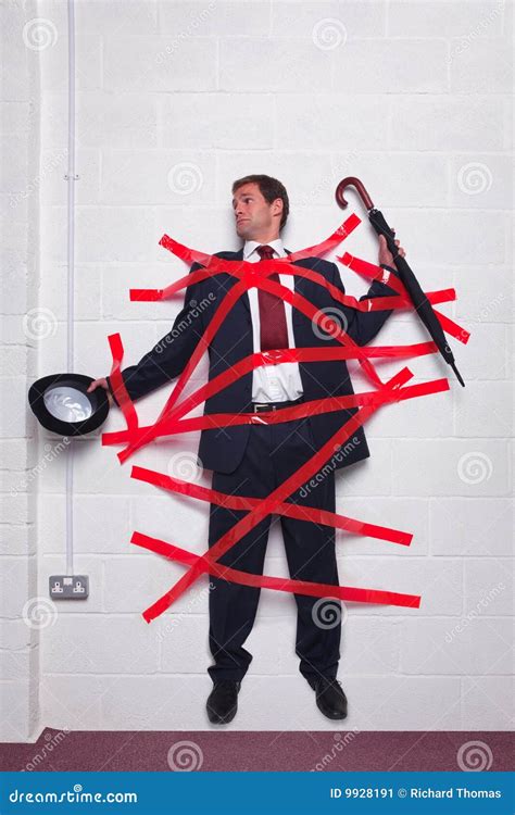 Businessman Stuck To Wall With Red Tape Royalty-Free Stock Photo ...