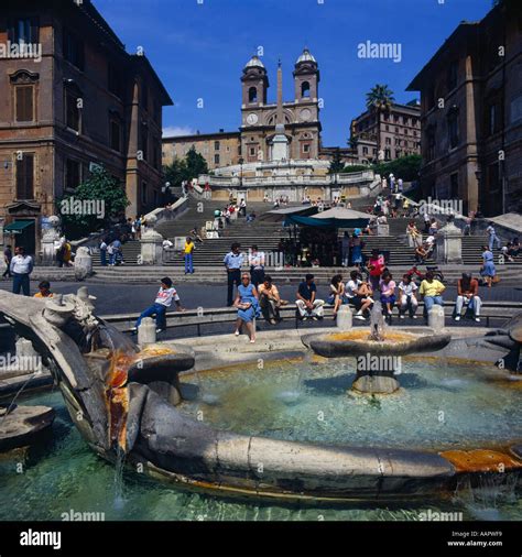 Spanish Steps People Sitting Around Barcaccia Fountain With Steps