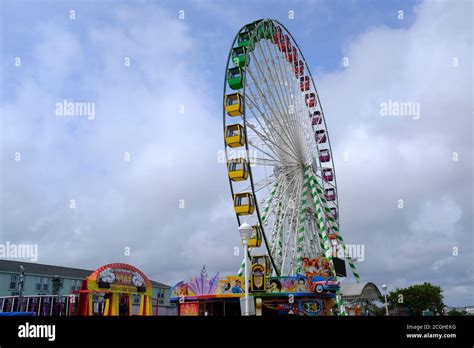 Ferris Wheel And Amusement Park Rides On The Boardwalk In Ocean City