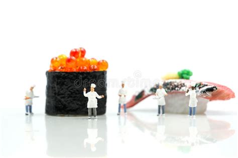 Miniature People Chef With Salmon Egg On Sushi Nigiri Roll On Stock