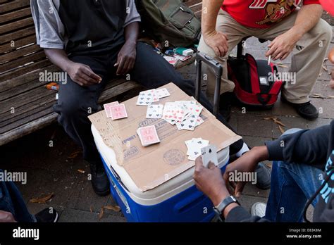 Men Playing Cards In Public Park Bench Usa Stock Photo Alamy