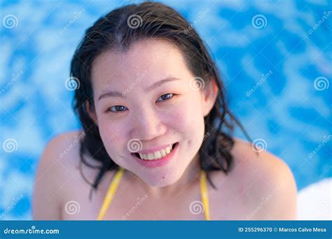 Summer Holidays Natural Portrait Of Young Happy And Attractive Asian Chinese Woman In Yellow