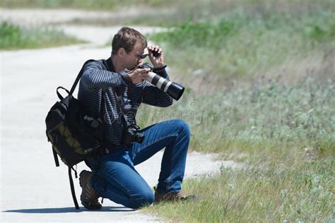 Photographer Chooses A Foreshortening Stock Photo Image Of Camera