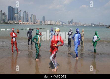 Chinese Women Wearing Facekinis Pose At A Beach Resort In Qingdao City