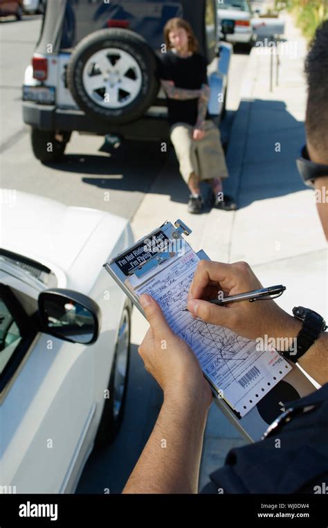 Police Officer Writing Ticket Stock Photo Alamy