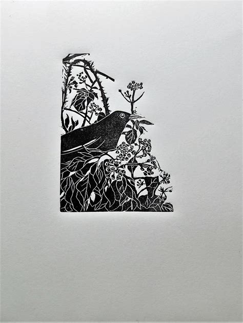 A Linoprint Of A Blackbird Perched In Ivy Linocut Printmaking